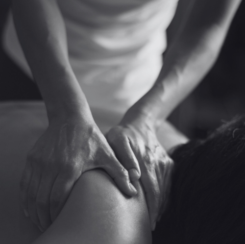 Deep tissue massage targeting shoulder muscles for pain relief in Crystal Palace & Clapham clinics